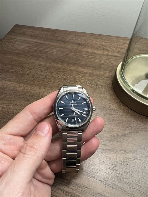 omega aqua terra vs cartier santos|Hands.